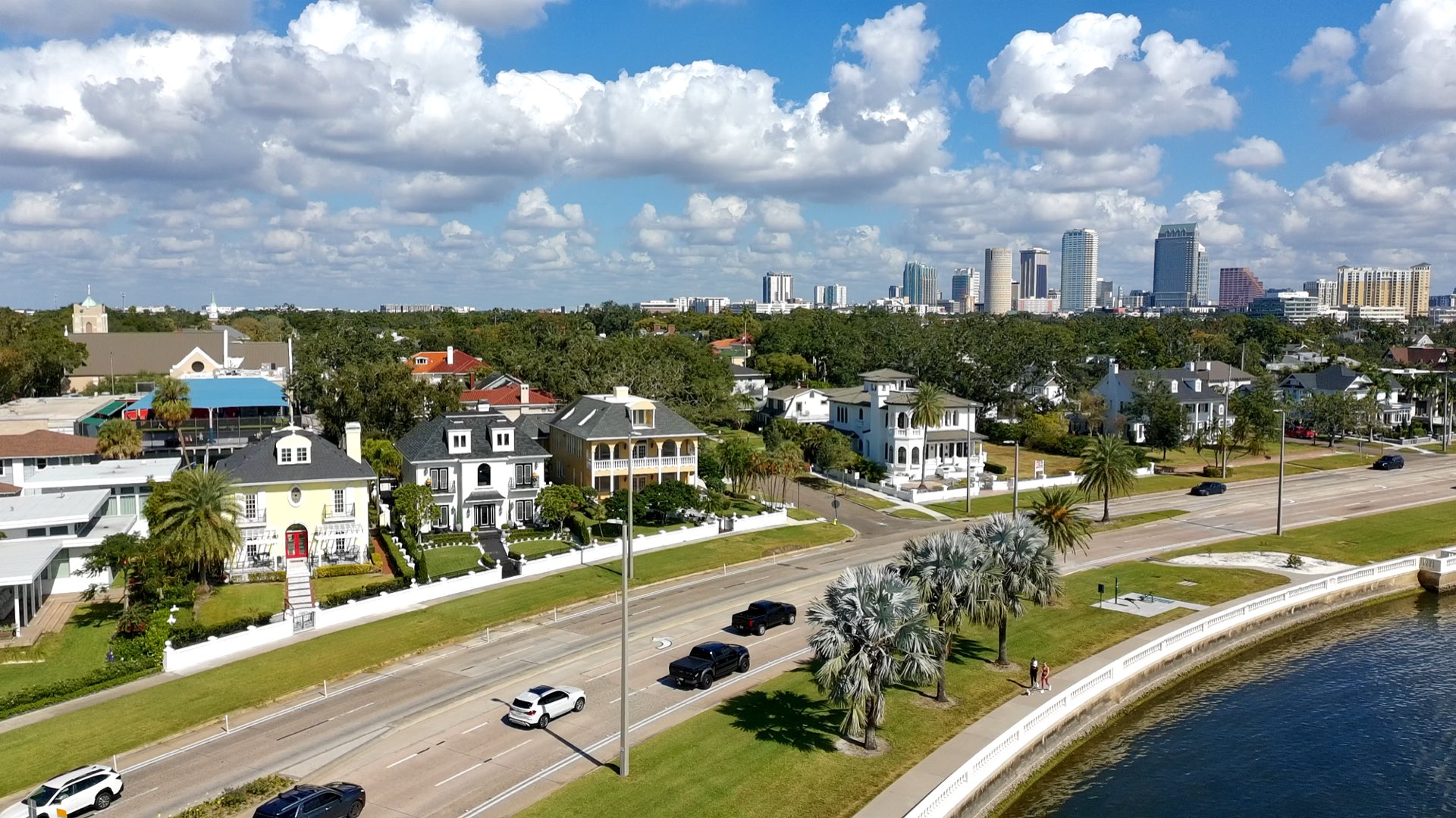 Bayshore Boulevard waterfront homes and the downtown Tampa skyline along Tampa Bay.